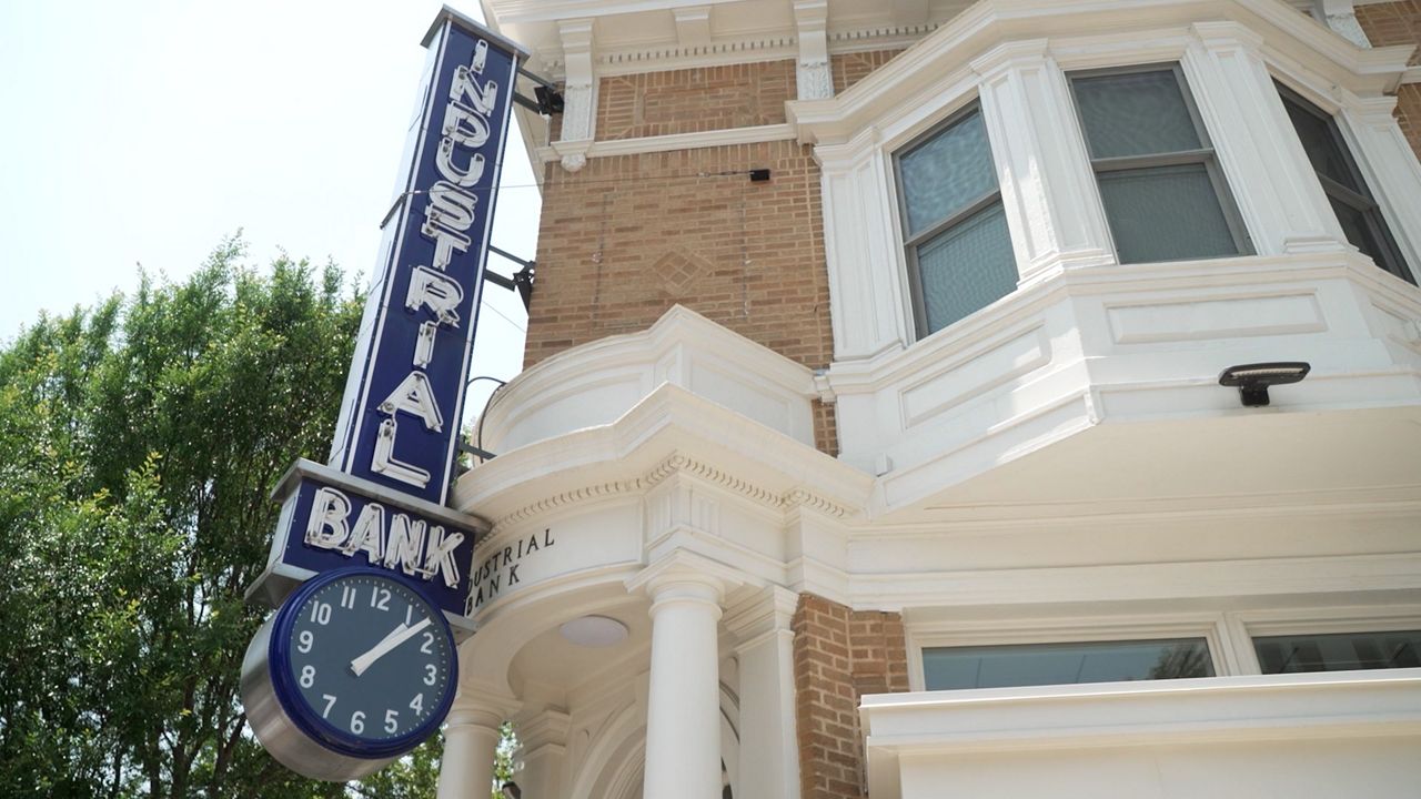 Industrial Bank street clock on the building — the landmark customers already know